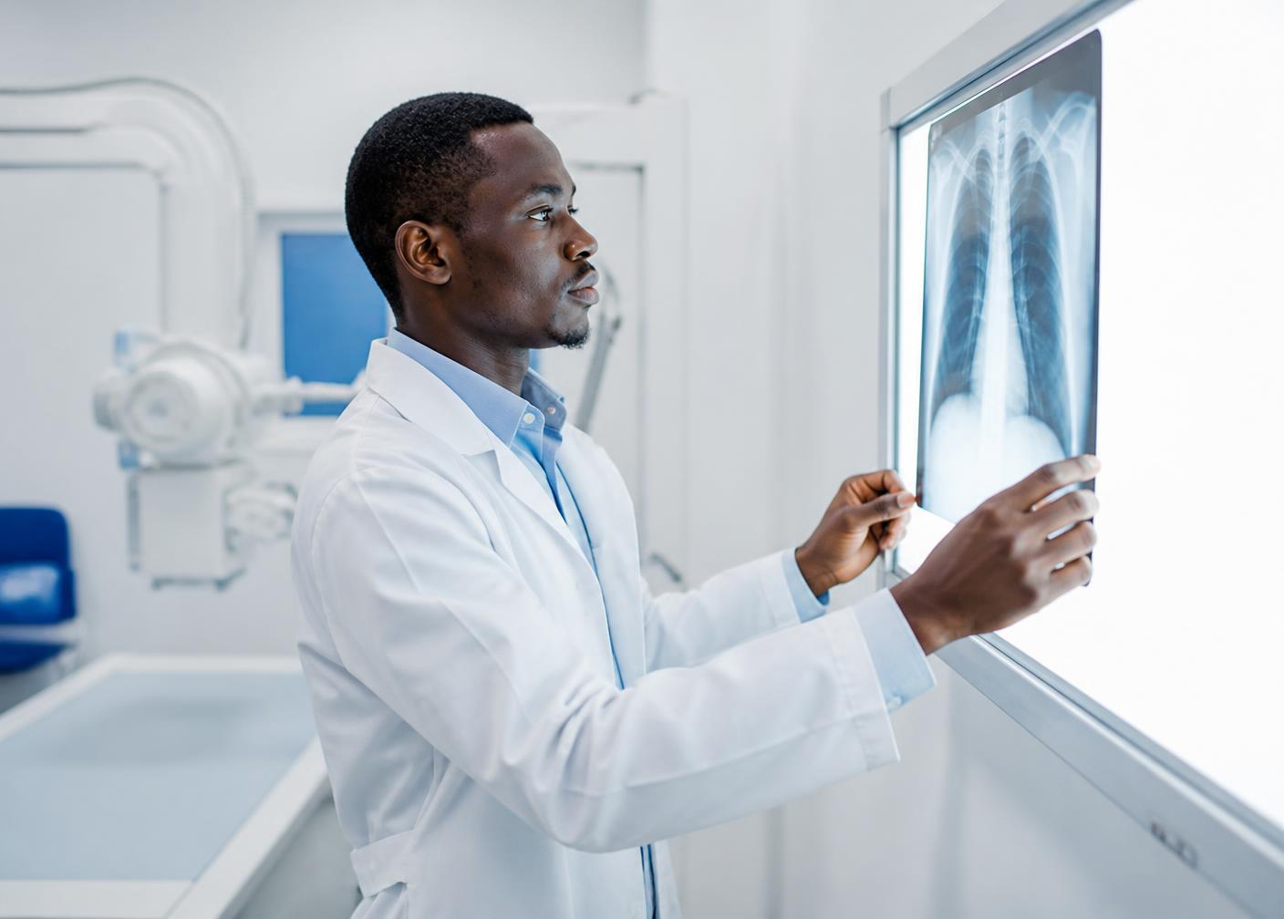 Radiographer reviewing an X-ray image